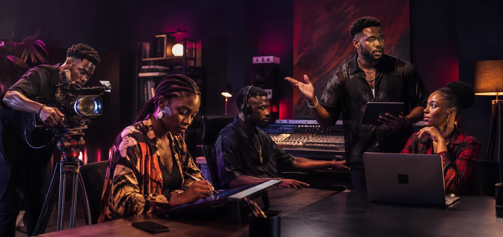 A team of Nigerian creative professionals collaborating in a studio